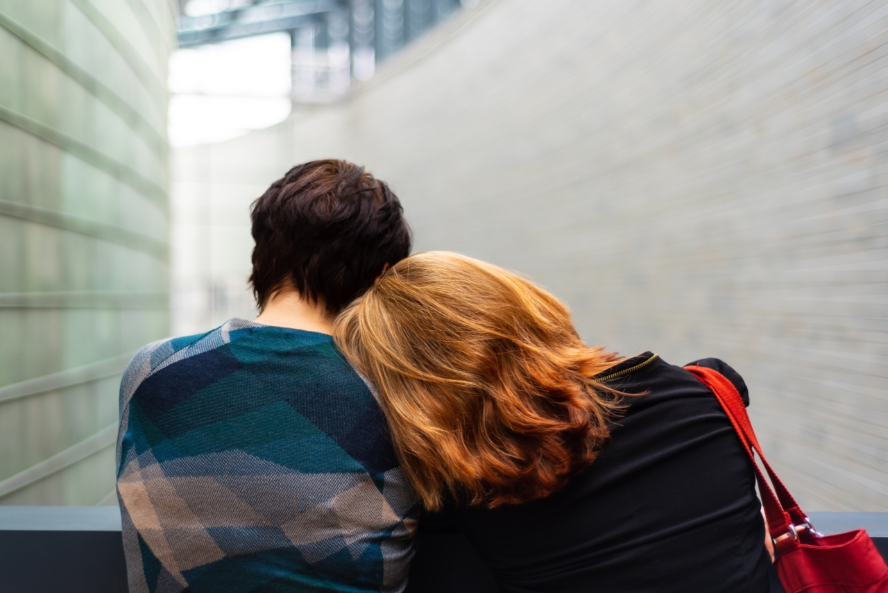 Couple leaning on one another